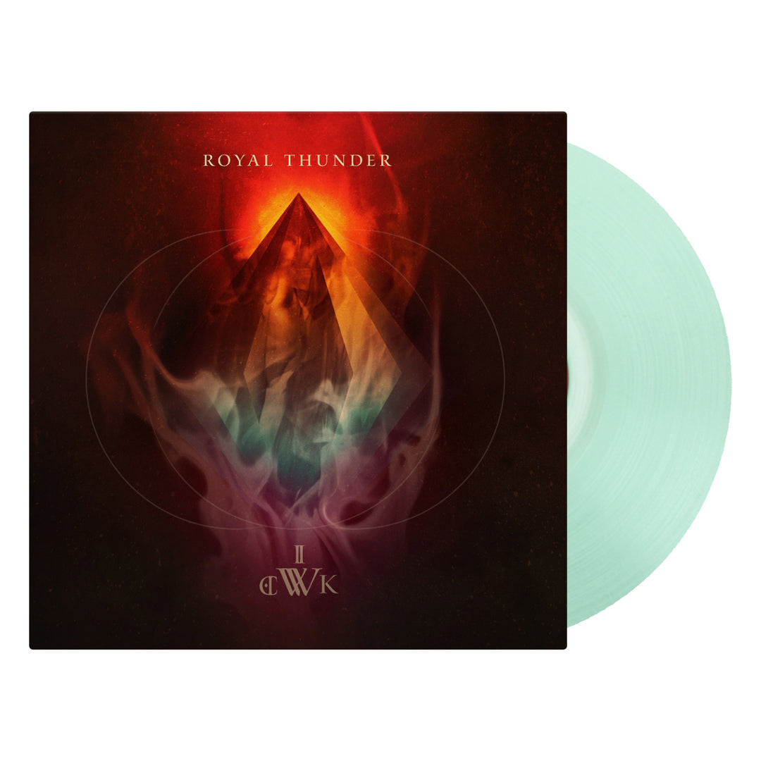 A vinyl record with a black cover featuring a graphic design of a mountain and the text 'ROYAL THUNDER', alongside a mint green vinyl disc.