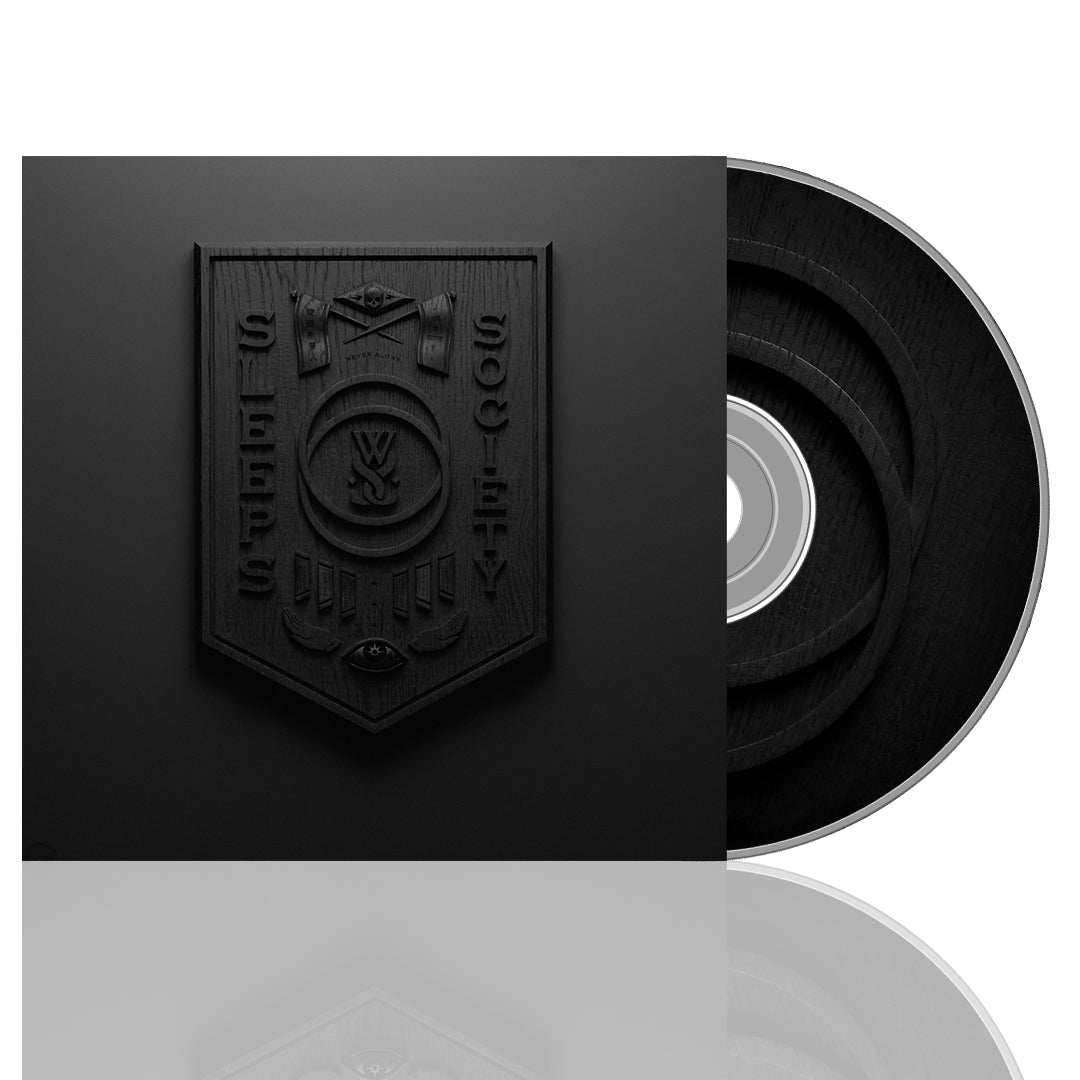 A black compact disc with a case featuring a black cover and a embossed emblem in the center. The CD is placed vertically beside its case.