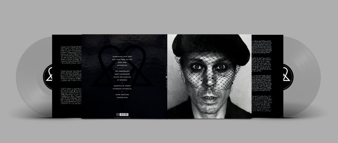 The 2023 VV vinyl album set includes silver discs and a cover depicting a person in a dark beret with netted veil, handwritten text in the background, and the stylized Heartagram symbol from Neon Noir.
