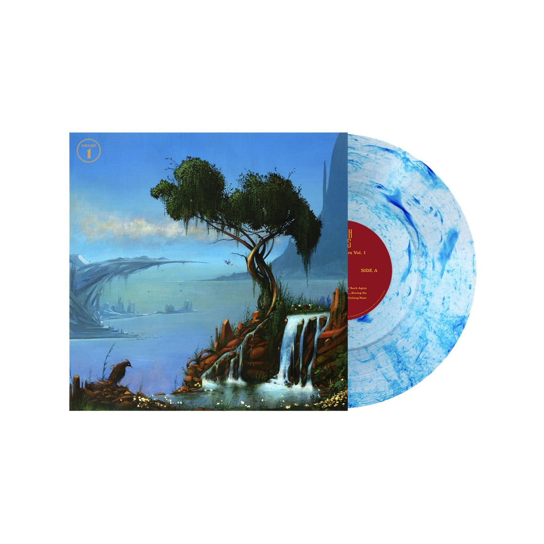 A limited edition 10 Crown Lands Wayward Flyers Volume 1 vinyl in blue-and-white marble slides from its cover, revealing surreal art with a twisted tree, rocky cliffs, waterfalls, and misty blue mountains beneath a calm sky.