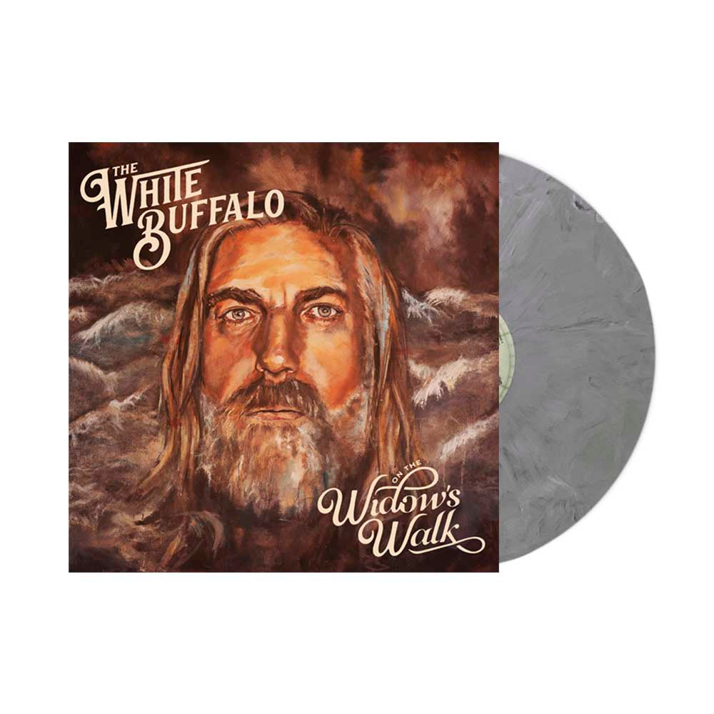 A marbled gray vinyl record by The White Buffalo is shown with its cover, featuring painted art of a long-haired, bearded man among clouds and the text: The White Buffalo, Widow’s Walk, and The Drifter.