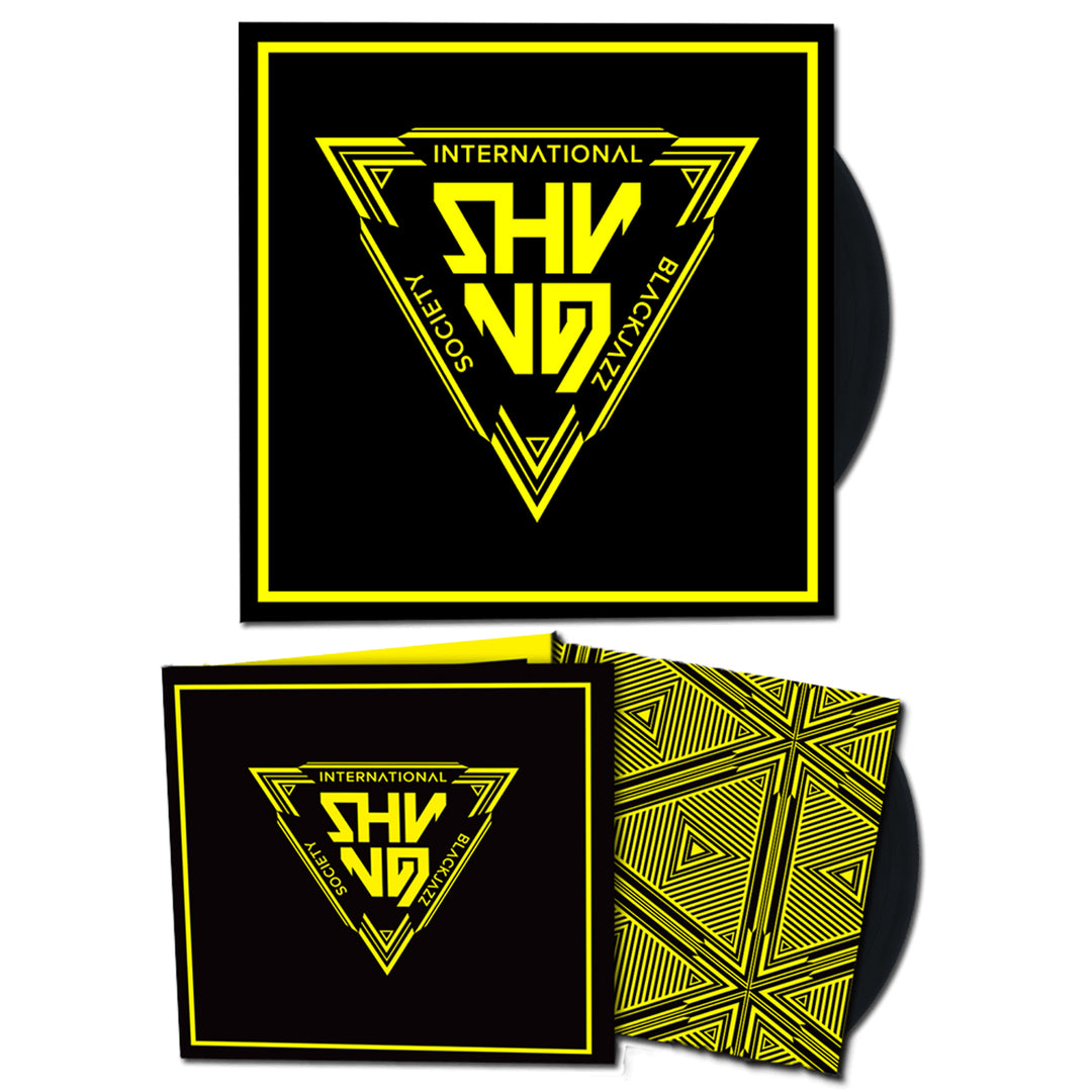 A Shining vinyl record and cover with bold yellow geometric art and INTERNATIONAL SHYNO BLACKJAZZ SOCIETY on black; the inner sleeve features intricate yellow lines inspired by House Of Warship.
