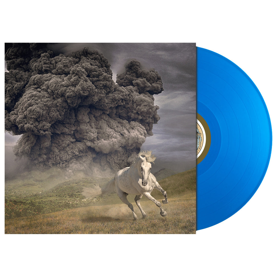A blue vinyl record by The White Buffalo slides out of its cover, showing a white horse escaping dark smoke across a grassy field—an ideal pick for those Winter Act 2 or Not Today moods.