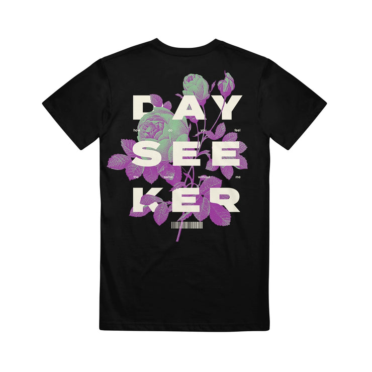 image of the back of the Botanical Black T-Shirt. full back print in white says dayseeker, with purple and green flowers 