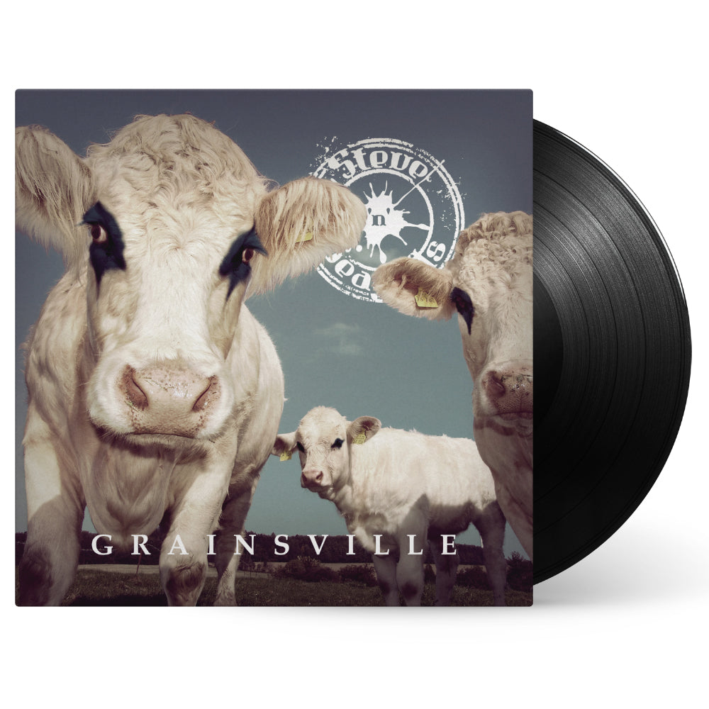 A vinyl record partially out of its sleeve shows Steve n Seagulls GRAINSVILLE album cover with three white cows in a grassy field under cloudy skies, featuring a circular logo and hints of tracks like Voodoo Child.