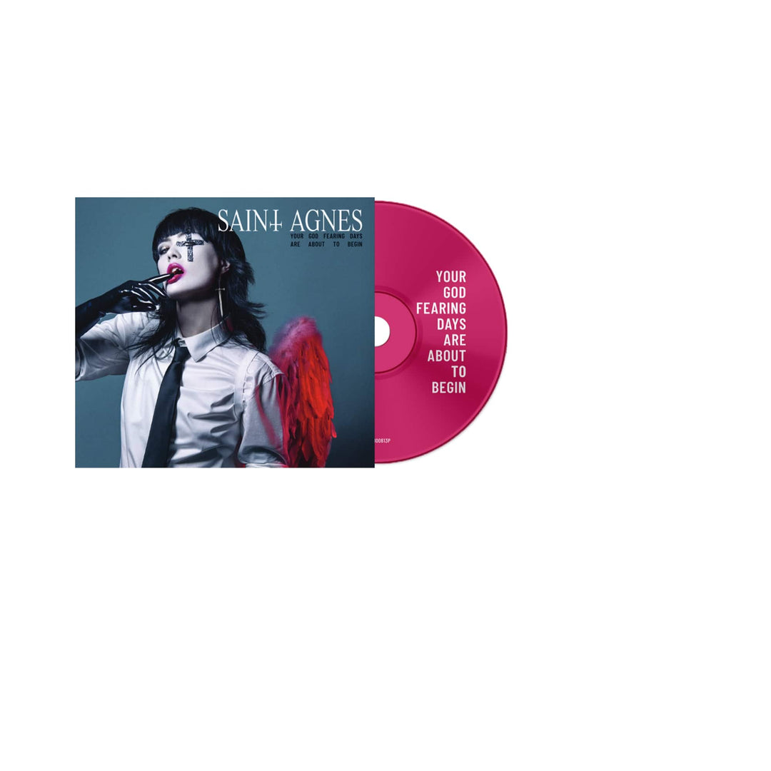 The Saint Agnes Bloodsuckers CD cover features a person in a white shirt and black tie with red wings and bold makeup. Get the God Fearing Days CD now via the exclusive presale or music bundle.
