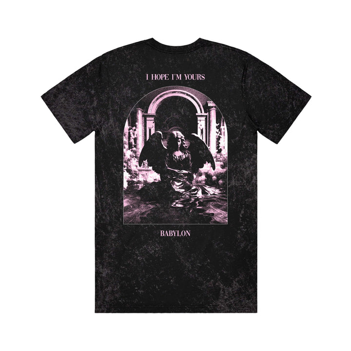 The Gore black mineral wash T-shirt features a kneeling angel graphic before an arched doorway, with “I HOPE IM YOURS” above and “BABYLON” below. It has a Colortone distressed, washed-out texture.