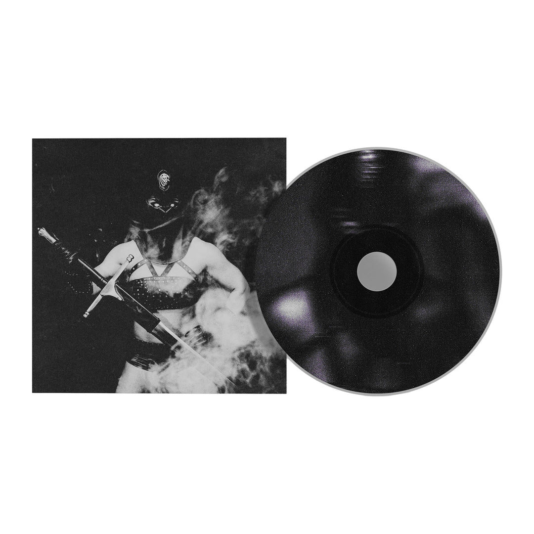 A Creeper Saguivore II CD beside its case, which shows the Mistress of Death in a studded outfit and police hat with a rifle, standing in smoke. Ideal for fans excited about the upcoming album presale.