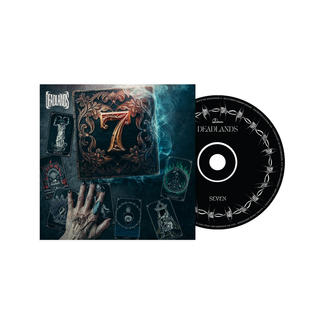 A music CD and cover by Deadlands. The cover features a ringed hand with tarot cards and a book marked "7," evoking Kundalini energy. The black CD, labeled "Deadlands - Seven," has a barbed wire design.