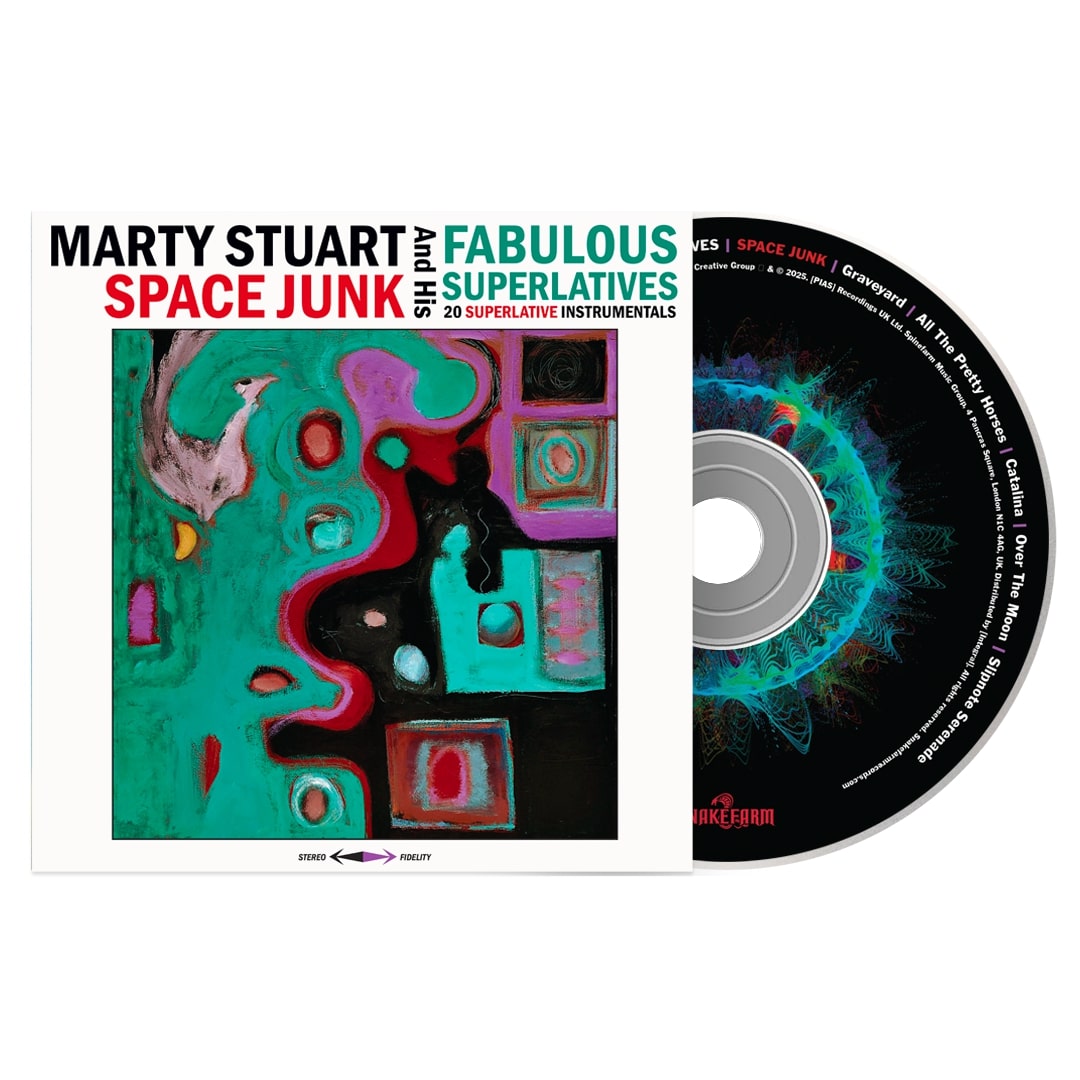 The image shows the album cover and CD for SPACE JUNK by Marty Stuart & His Fabulous Superlatives. The limited edition LP features bold abstract art in pink, black, turquoise, and red with geometric shapes and brushstrokes.