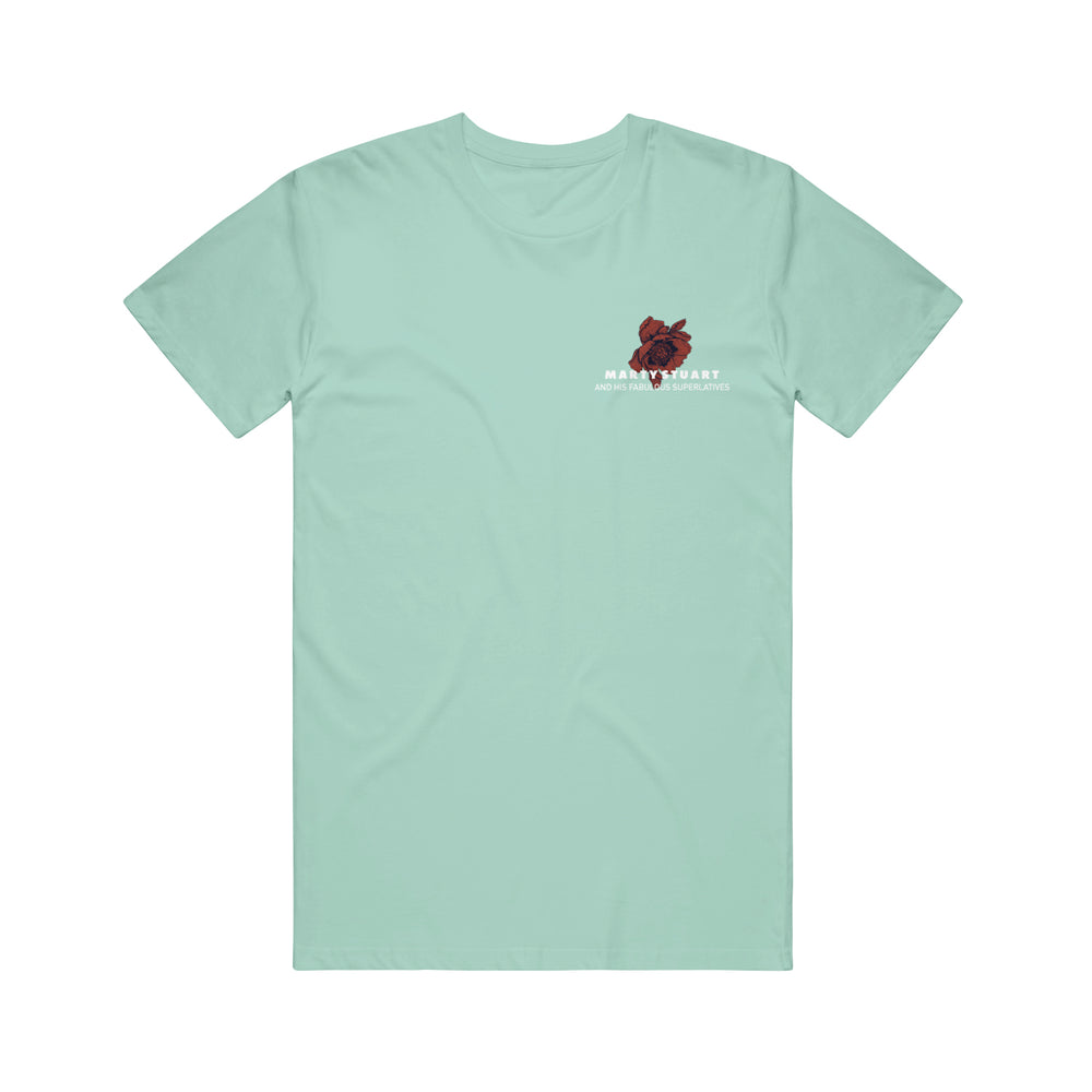 Light teal unisex t-shirt in Floral Mint, featuring a small red anatomical heart and the words “Main Heart” and “Marty Stuart & His Fabulous Superlatives” on the left chest. Displayed on a plain white background.