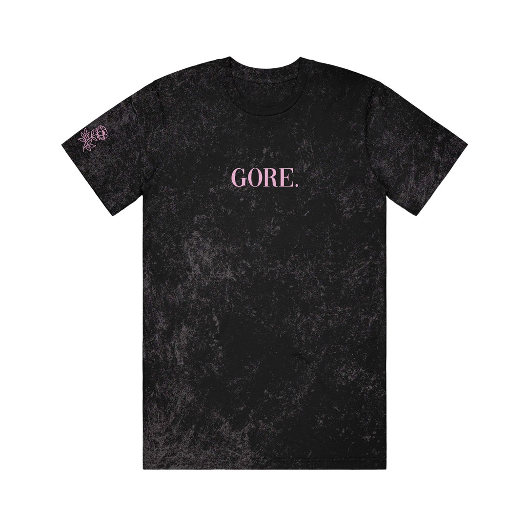 Gore. Black Colortone mineral wash T-shirt featuring GORE. in pink capital letters centered on the chest and a small pink graphic on the left sleeve.