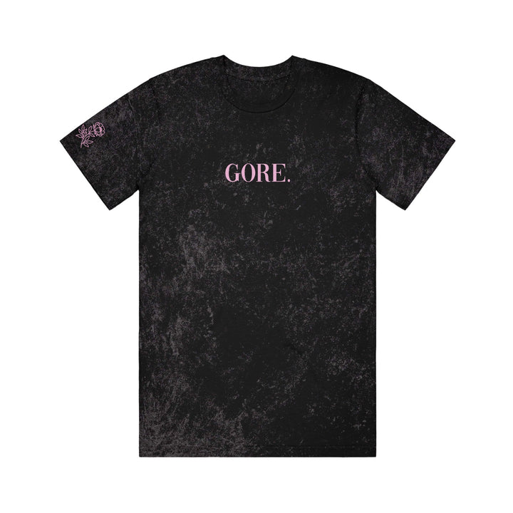 Gore. Black Colortone mineral wash T-shirt featuring GORE. in pink capital letters centered on the chest and a small pink graphic on the left sleeve.