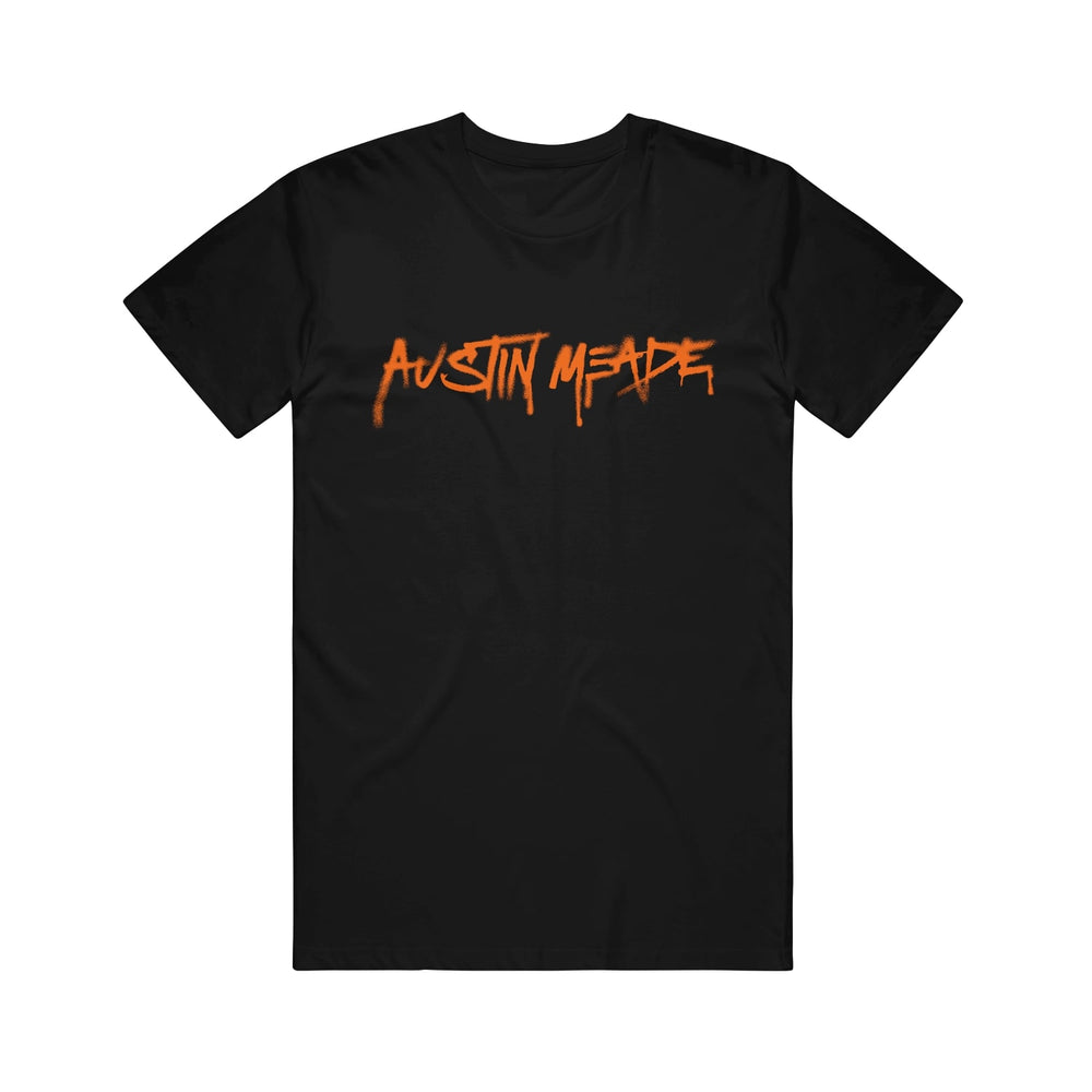 Black streetwear t-shirt by Austin Meade featuring bold, orange, graffiti-style lettering across the chest.