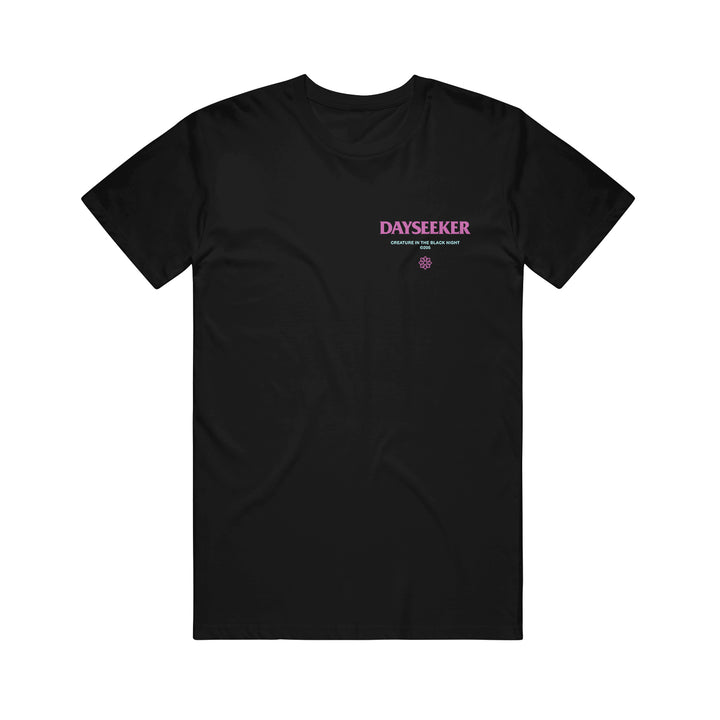 Black t-shirt by Dayseeker featuring large pink DAYSEEKER text on the left chest, smaller white text below it, and a small purple coffin emblem underneath.