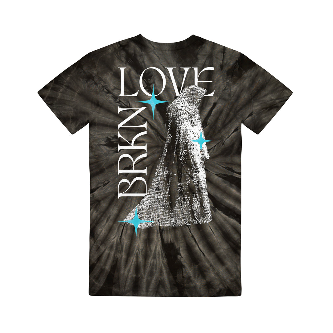 BRKN Love black tie-dye t-shirt featuring bold “BRKN LOVE” white text, blue star-like accents, and a grayscale cloaked figure in the center. Artistic and eye-catching design.