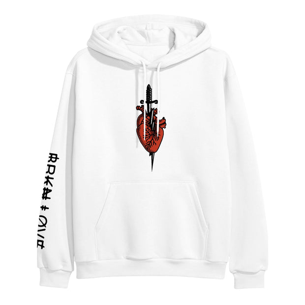 image of a white pullover hoodie on a white background. front print of a heart with a dagger. bottom left sleeve has black print that says broken love