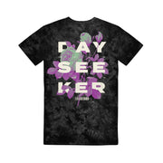image of the back of the Botanical Black Crystal Wash T-Shirt. full back print in white says dayseeker, with purple and green flowers 