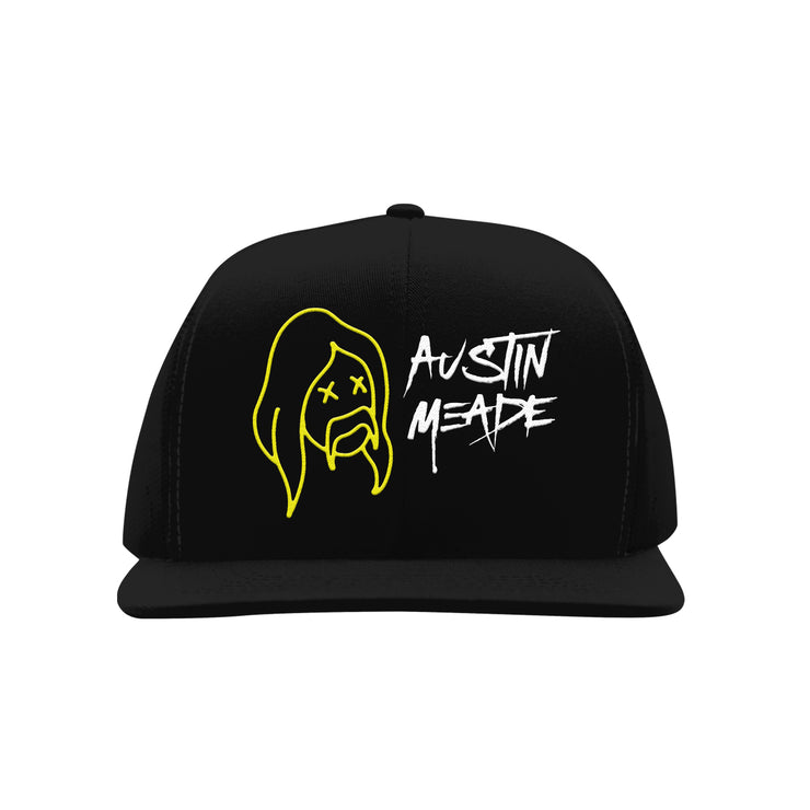 image of the front of a black snapback hat. front embroidery in yellow of a long haired man with a mustache and two X's for eyes. next to it in white embroidery says austin meade