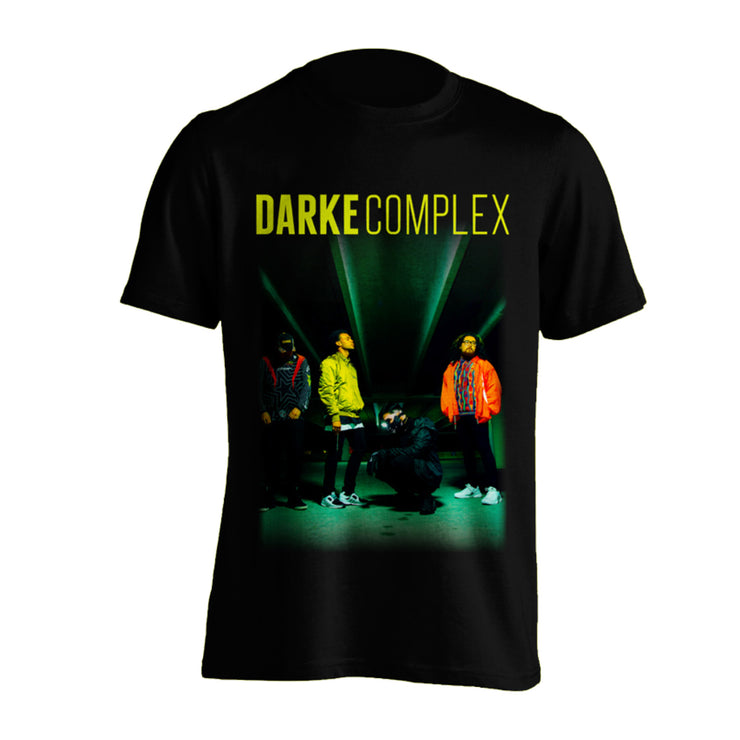 image of the front of a black tee shirt on a white background. tee has color image of the band members and darke complex across the top. 