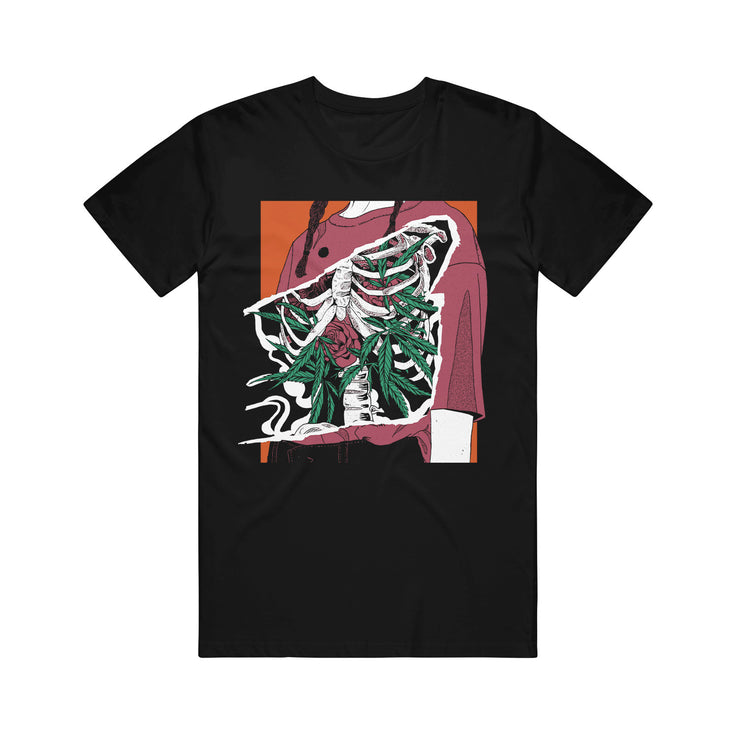 image of a black tee shirt on a white background. tee has center print of an open rib cage with roses and marijuana leaves coming out.