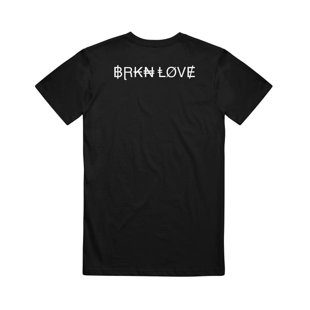 image of the back of a black tee shirt on a white background. tee has white print across the shoulders that says broken love