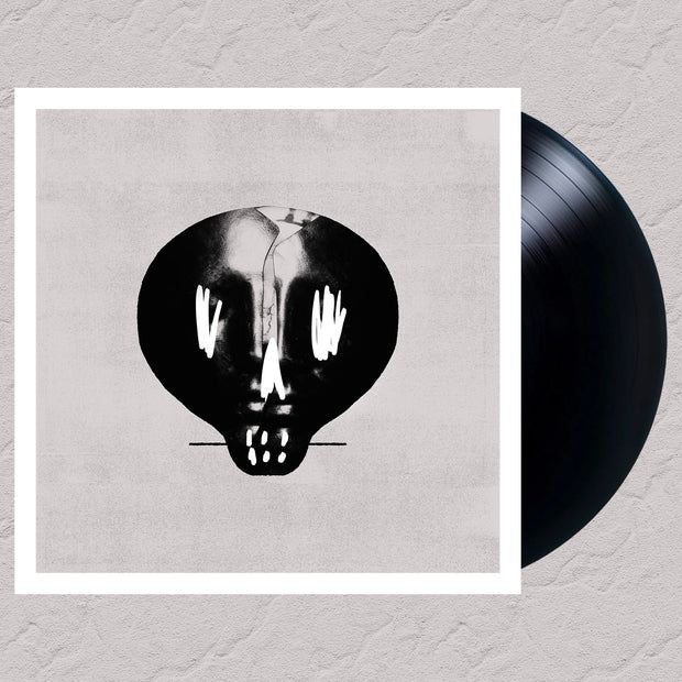 image for the Self Titled Black Vinyl. vinyl on the right cover on the left is a black and white skull