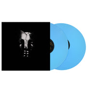 image for the IMPORT Self Titled Deluxe Edition Baby Blue Vinyl LP. two records on the right, cover on the left is a black and white skull