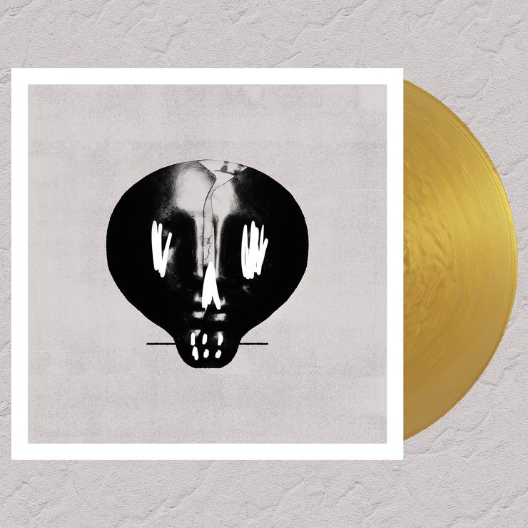 image for the Self Titled Gold Vinyl. vinyl on the right cover on the left is a black and white skull