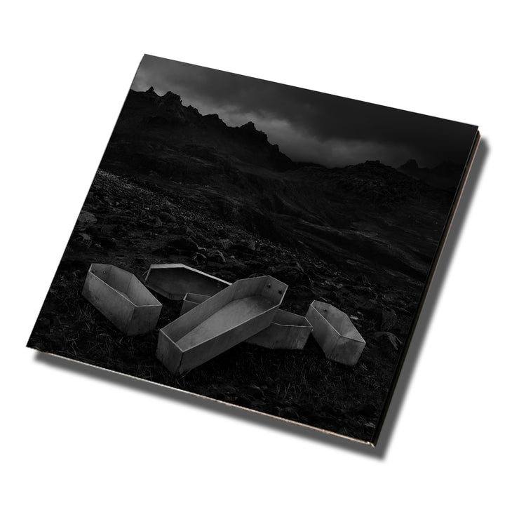 image for the Long Live CD. cover is a black and white photo of open coffins outside