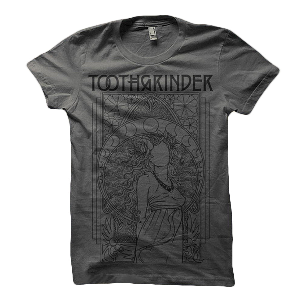 A dark gray Toothgrinder T-shirt with the band name above an intricate line art of a woman with flowing hair, surrounded by geometric patterns and moon phases.