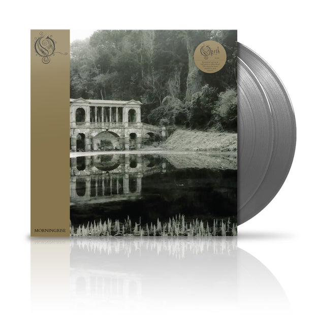 Opeth "Morning Rise" Vinyl LP. vinyl exposed to show color of vinyl, color is Silver. Album art shows creepy stone bridge in the woods near a small pond.