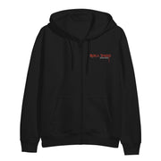 image of the front of a black zip up hoodie on a white background. small right chest print in red says black sheep, austin meade