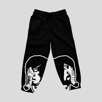 image of black sweatpants. each leg has a white print of a face with an eleephant trunk