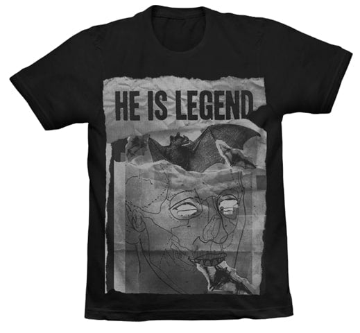 image of a black tee shirt on a white background. tee has full body print of a black and white image of a bat with a face scribbled over it. at the top says he is legend
