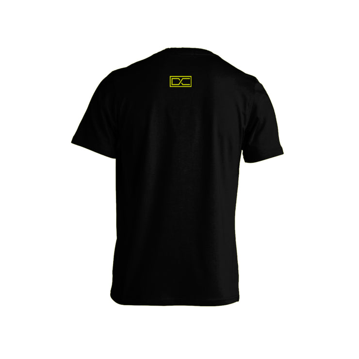 image of the back of a black tee shirt on a white background. tee has a small yellow print at the top center of the letters D C