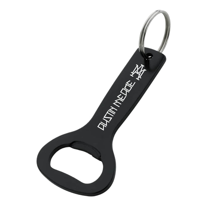image of a black keychain bottle opener. in white on it says austin meade with a badge symbole of the letters A and M